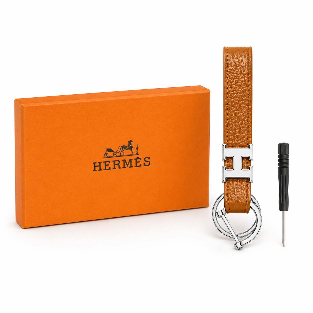 Hermès keychain features grained caramel brown