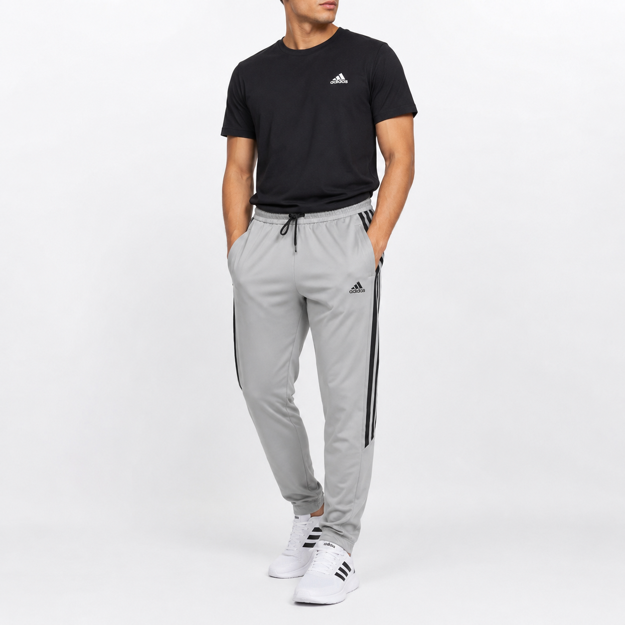 Adidas Tiro training pants featuring classic three-stripe