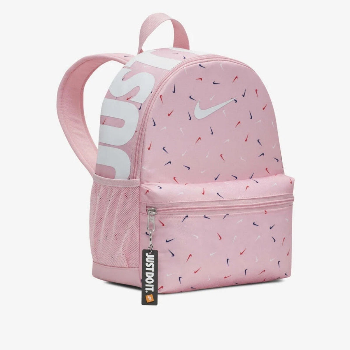 Pink Nike mini backpack with multicolor swoosh print on a light pink background.