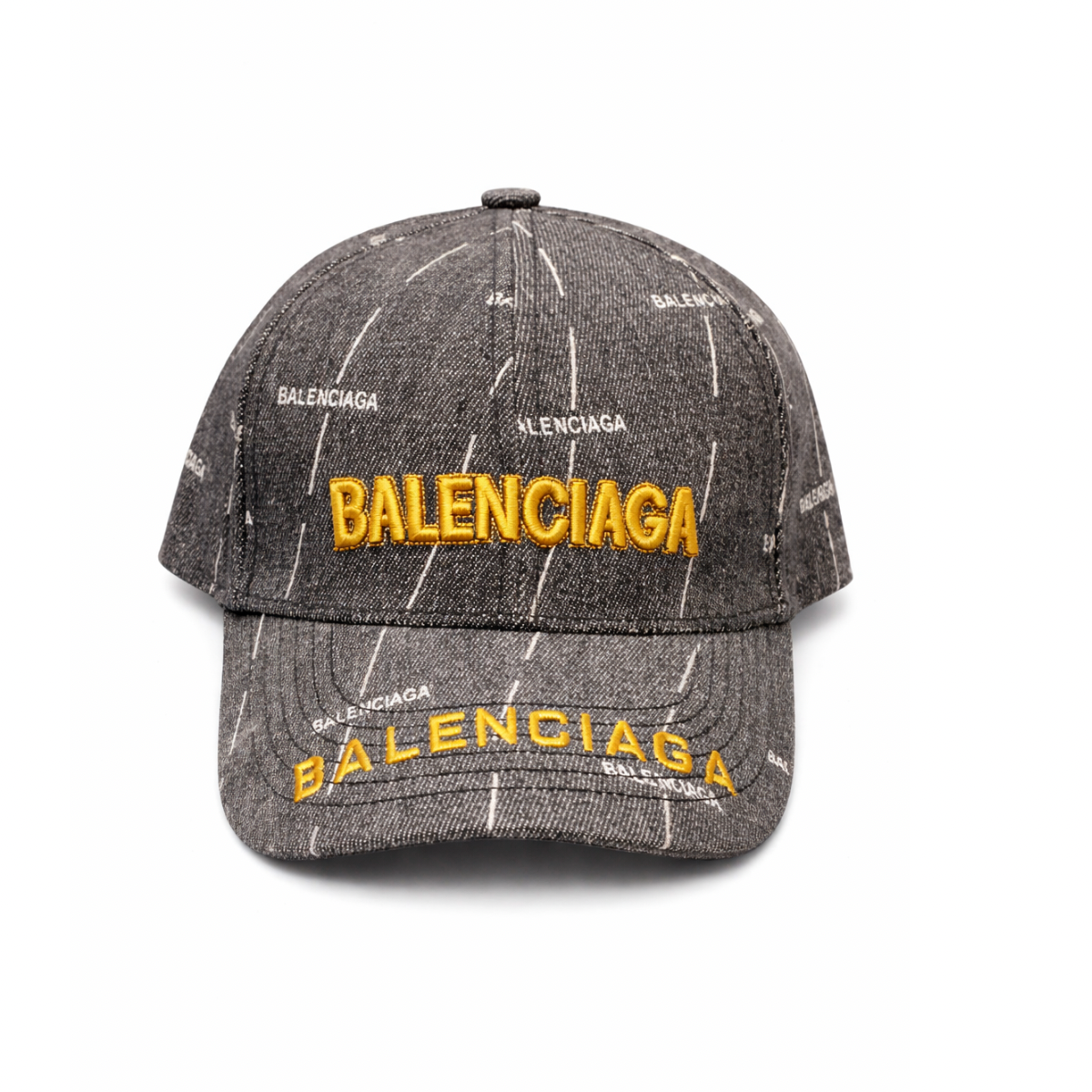 Gray cap with yellow 'Balenciaga' branding on a white background
